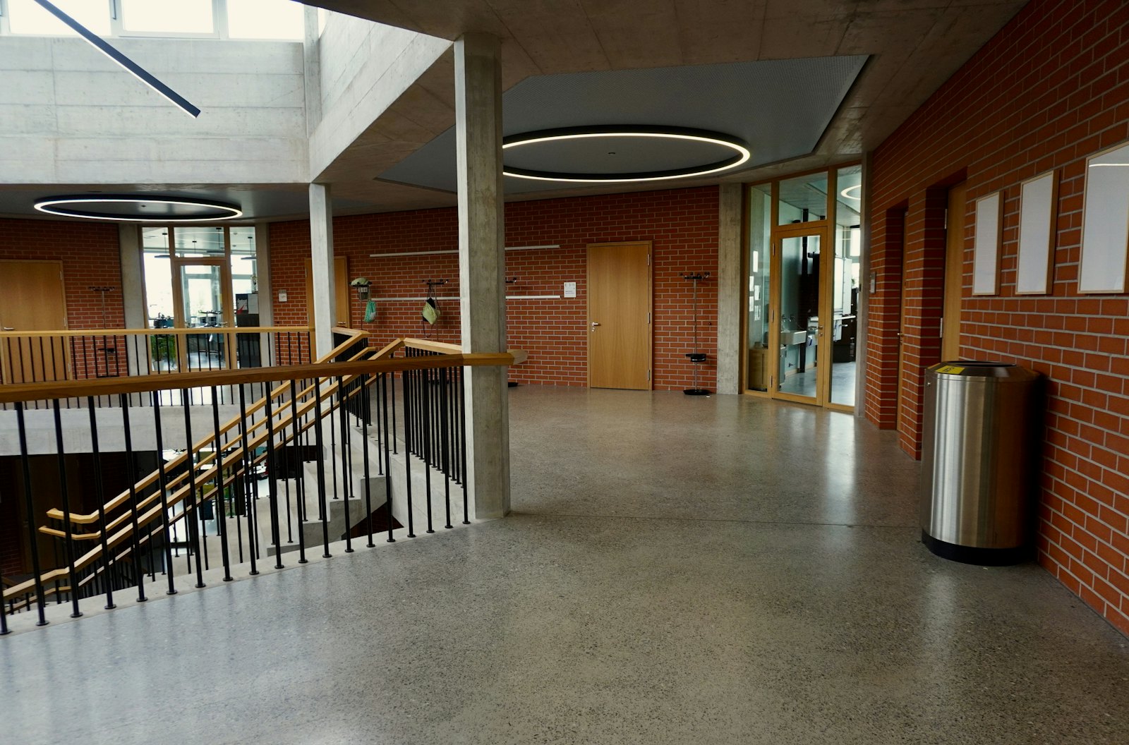 Bright hallway with a speckled, terrazzo-style flake floor